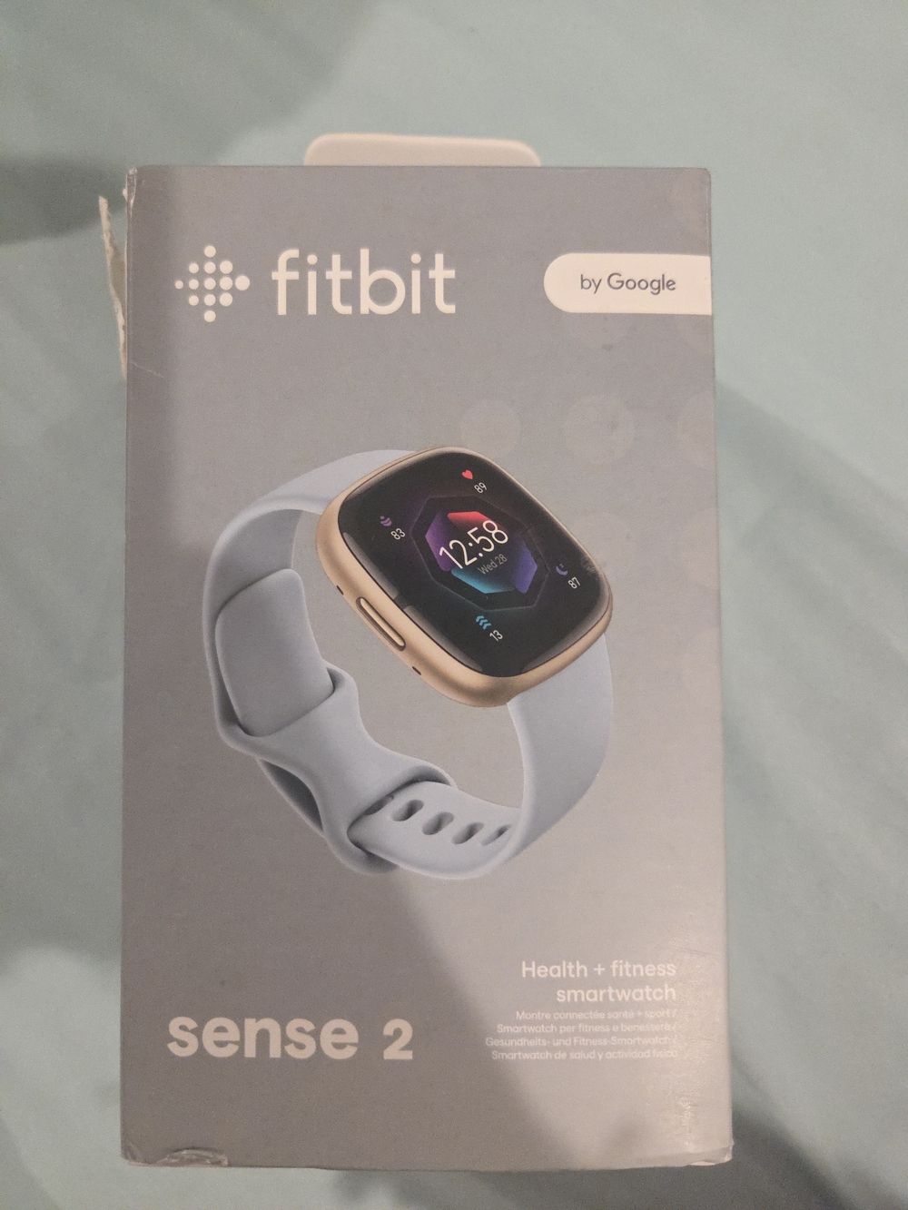 fitbit Sense 2 Gold Case with Light Blue Band